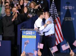 Marxocrat Buttigieg laying a big wet one on her husband Marxocrat Buttigieg laying a big wet one on her husband